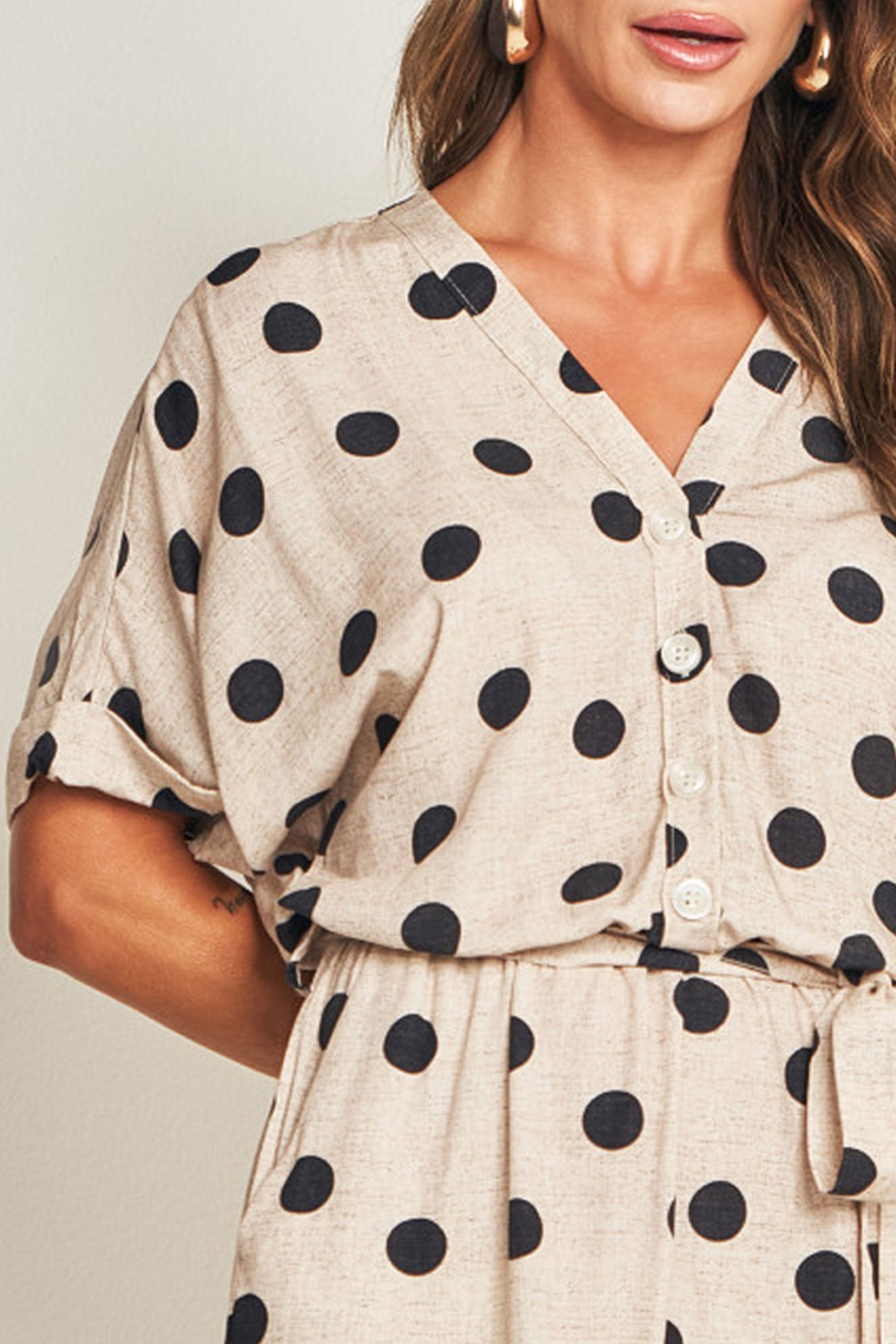 Macaquinho com estampa folhagem e amarração resort